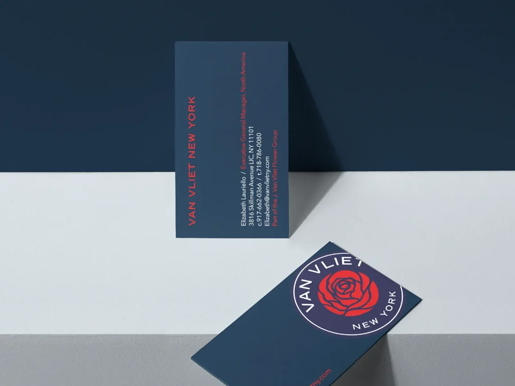 Premium navy blue and red business cards featuring custom typography, crafted in NYC for growing international brands.