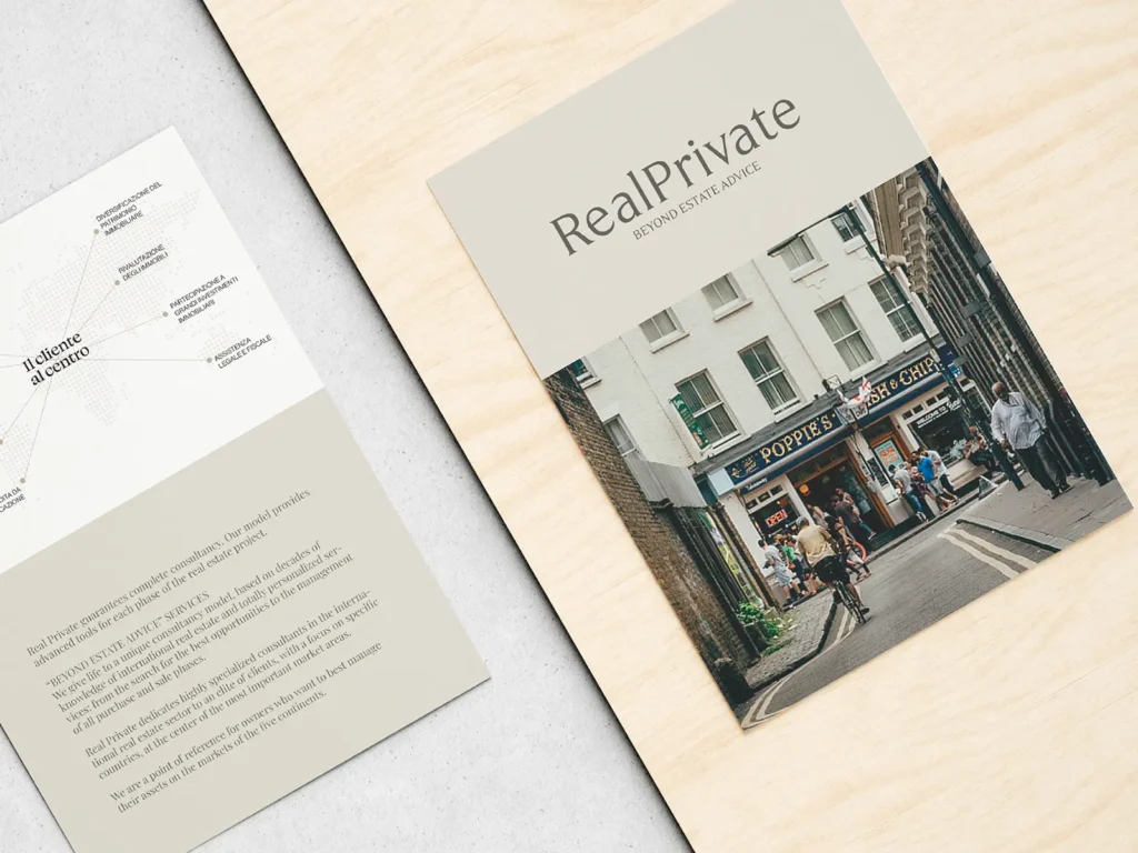 Custom property management flyer featuring high-resolution photography, printed on 130lb cover stock at our Manhattan print shop and styled on a light wood grain surface.