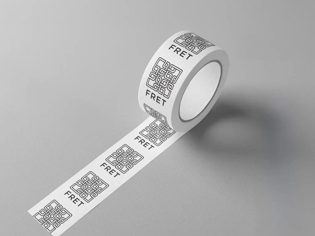 Custom branded packaging tape with a repeated geometric logo, produced in our studio to help growing businesses enhance their unboxing experience.