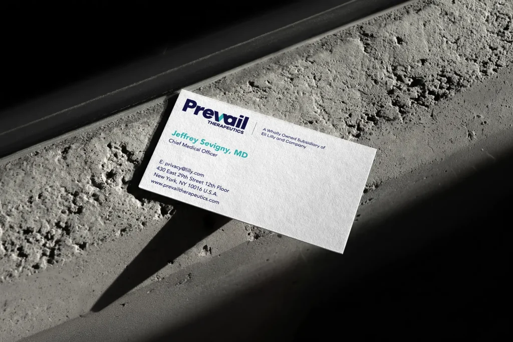 White 17pt mohawk superfine eggshell rush business card for Prevail Therapeutics featuring sharp blue and teal printing, available for same-day turnaround at our NYC print shop.