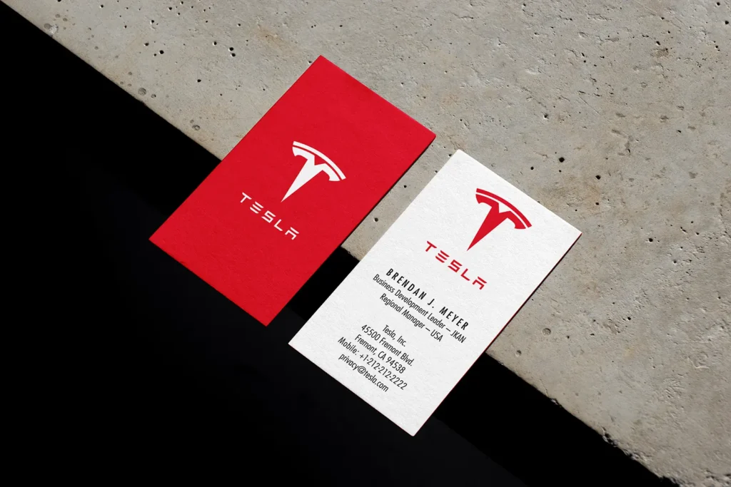 High-quality standard business cards for Tesla featuring vibrant red and white full-color printing, custom-made at our Manhattan-based print shop.