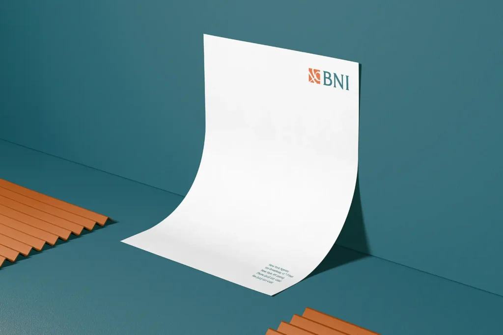 Professional BNI letterhead custom-printed on 24lb Classic Crest Solar White paper, shown leaning against a blue wall to highlight the crisp US Letter size (8.5 x 11 in) produced at our Manhattan print shop.