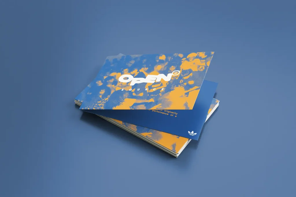 Custom vibrant blue and orange Adidas notecards printed on matte 14pt Uncoated White paper, produced at our Manhattan print shop to ensure sharp, high-impact color for branded stationery.