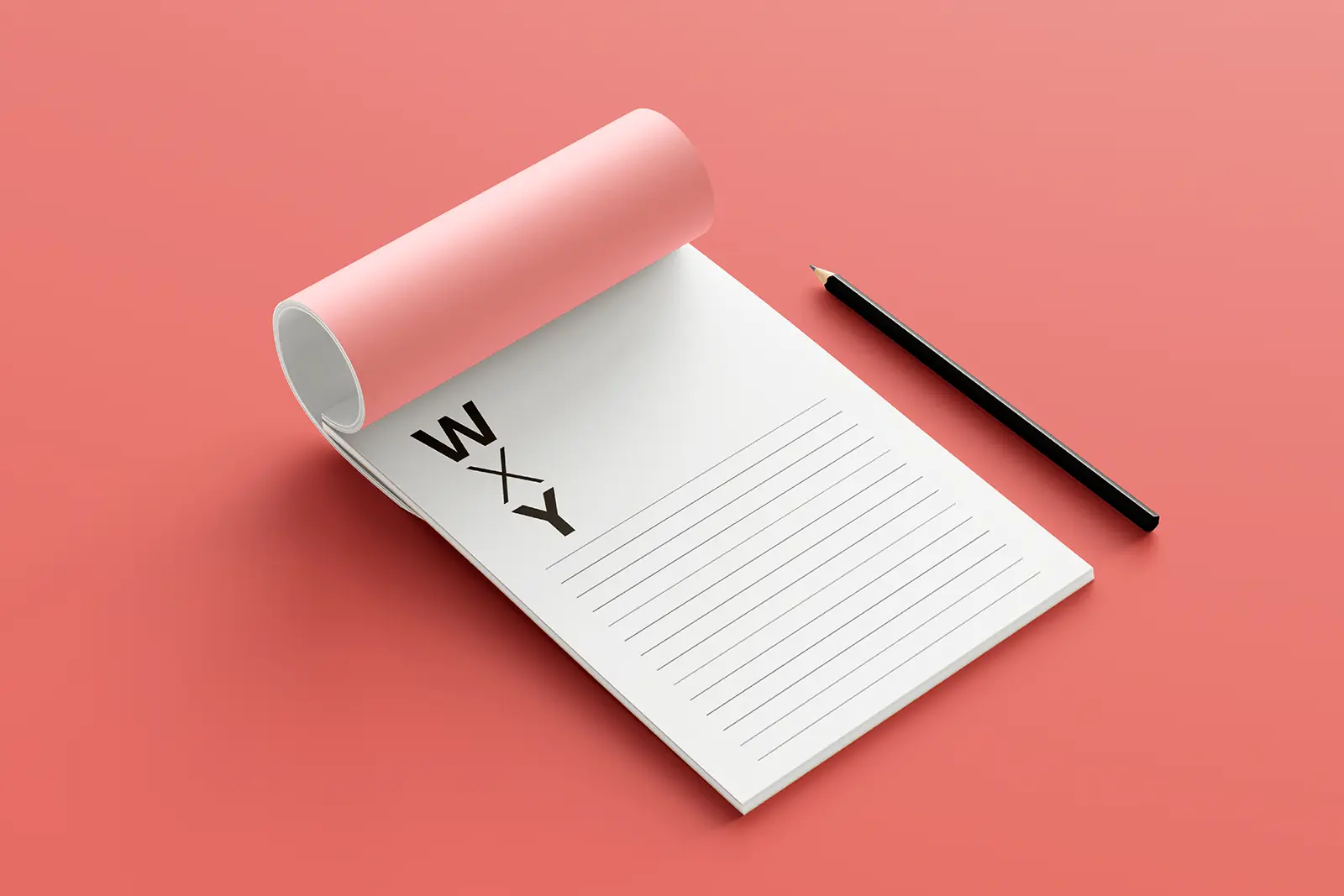 Personalized 5.5 x 8.5 inch notepad for WXY featuring sharp black typography and lined paper, shown on a minimalist pink desk setup to showcase our functional office stationery.