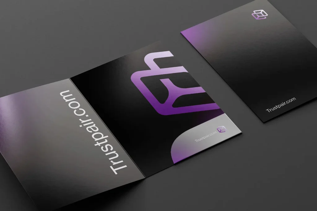 Custom presentation folders for Trustpair featuring a vibrant purple gradient logo on sleek black stock, printed on heavy 110lb White Smooth Matte (approx. 300 GSM) at our Manhattan print shop.