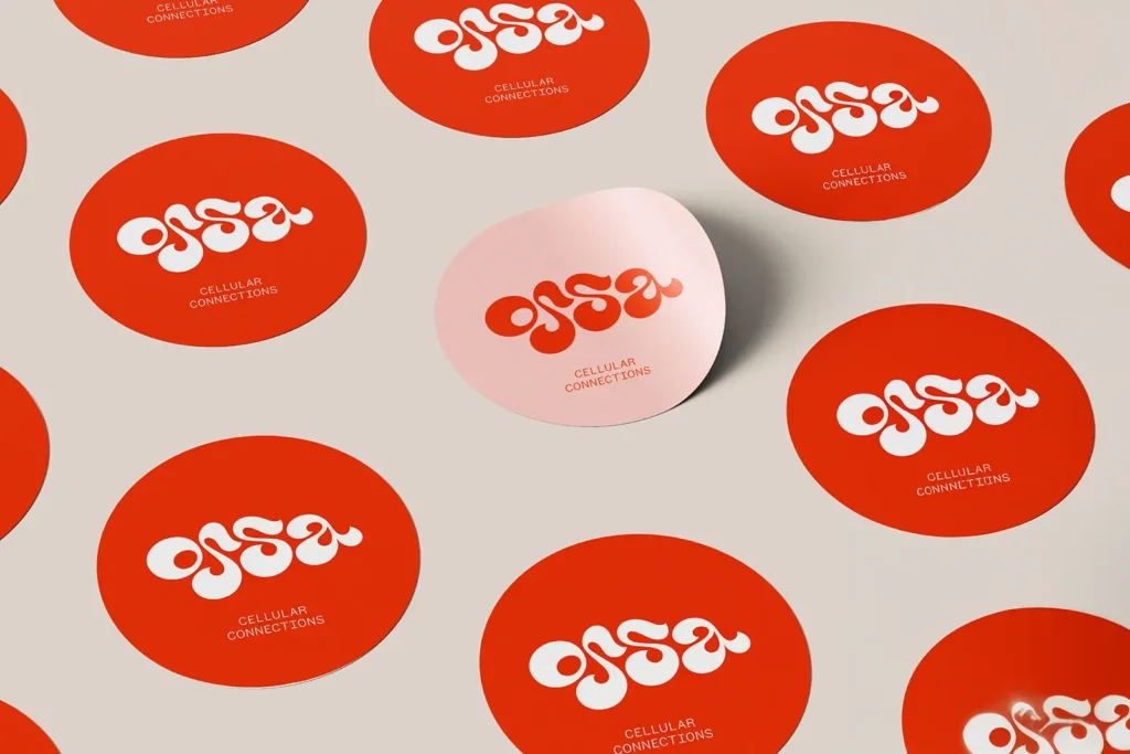 Custom red "ossa Cellular Connections" circle labels (2.5 x 2.5 in) printed on 70lb semi-gloss stock at our Manhattan print shop, featuring crisp rendering for branded packaging.
