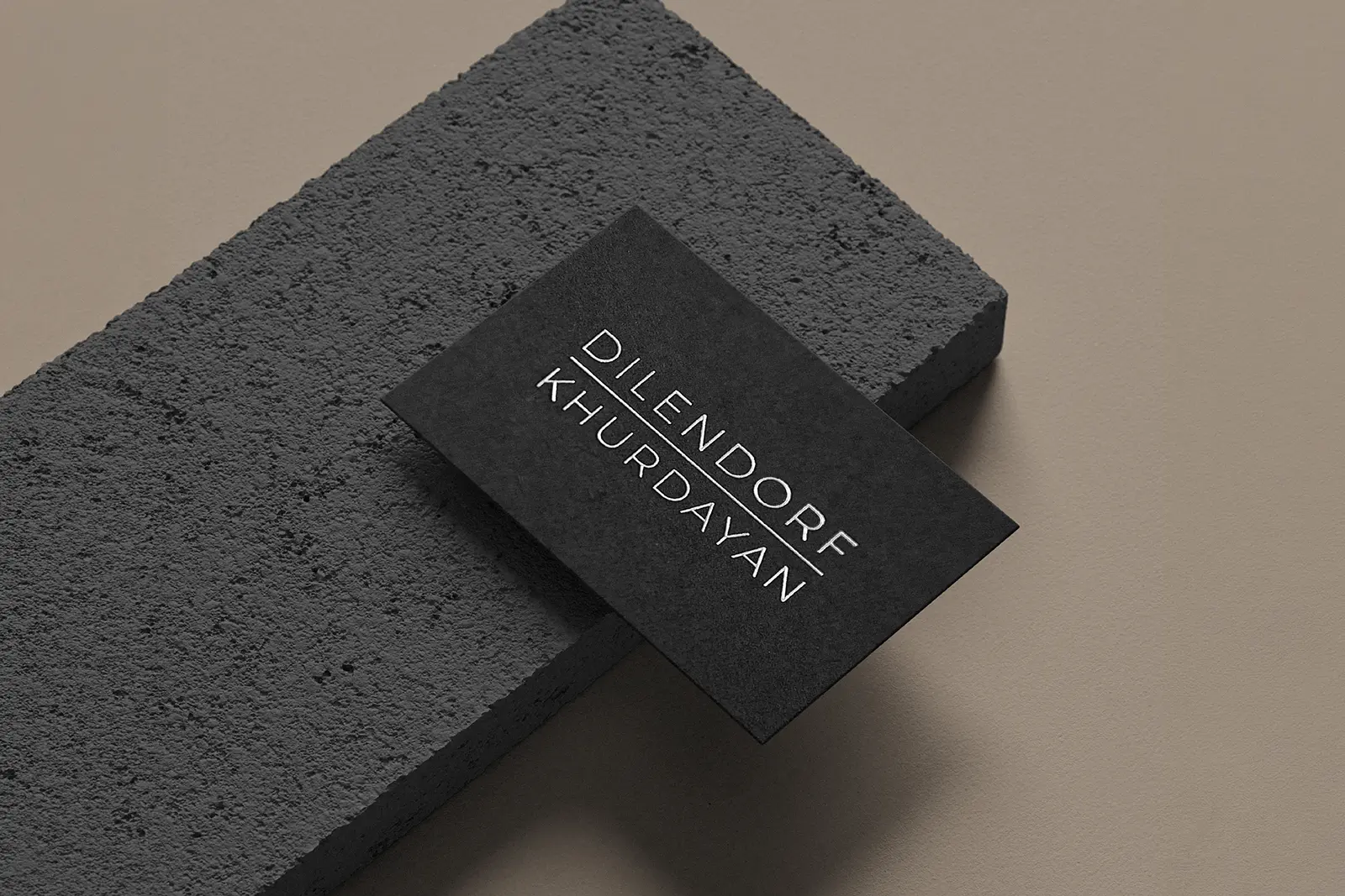 Sleek black business cards for Dilendorf Khurdayan with elegant gold foil stamping, locally printed in Manhattan on thick, matte premium stock.