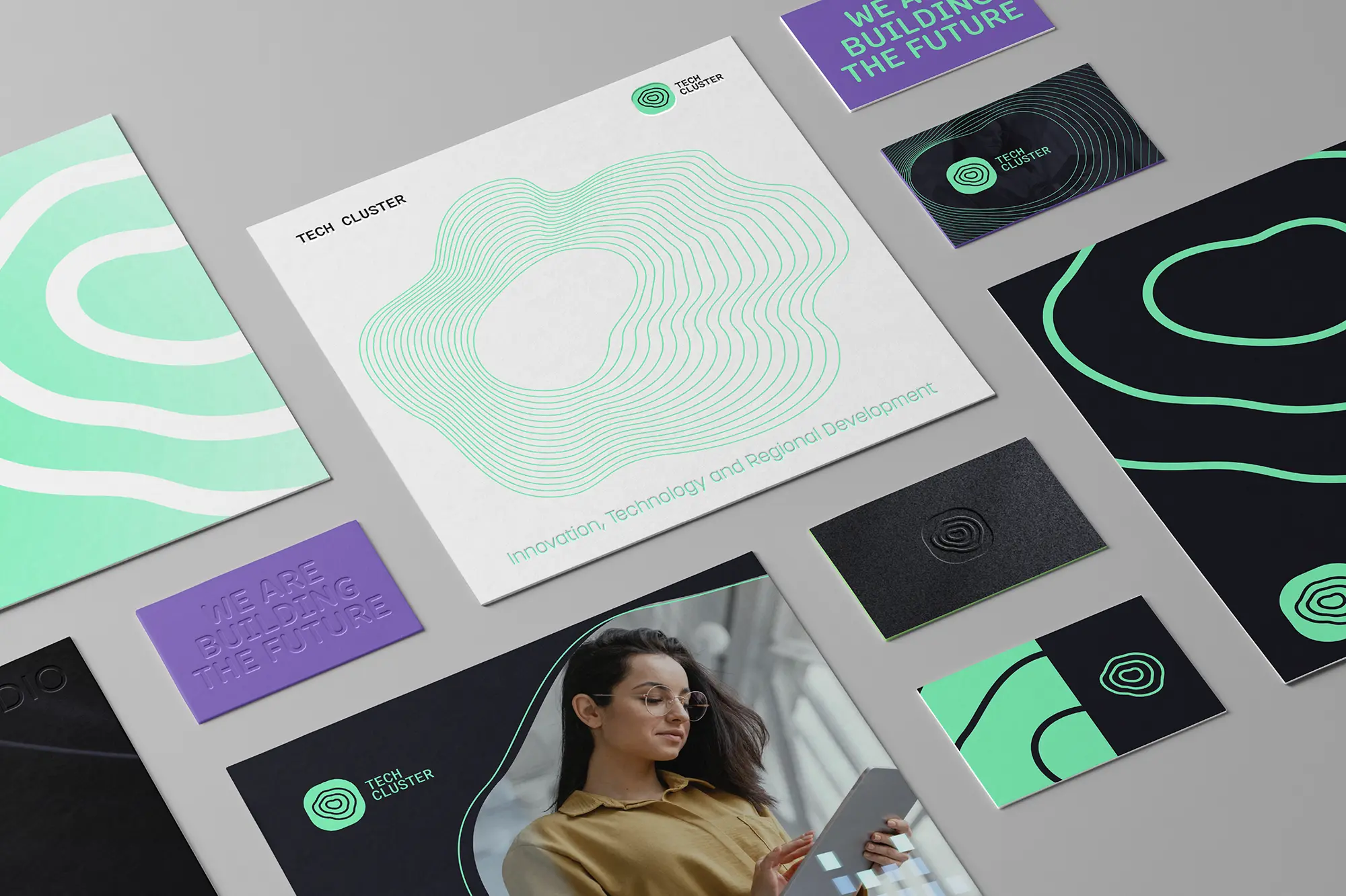A comprehensive brand identity kit featuring business cards printed on 350 GSM stock, produced at our NYC shop and laid out on a light grey surface.