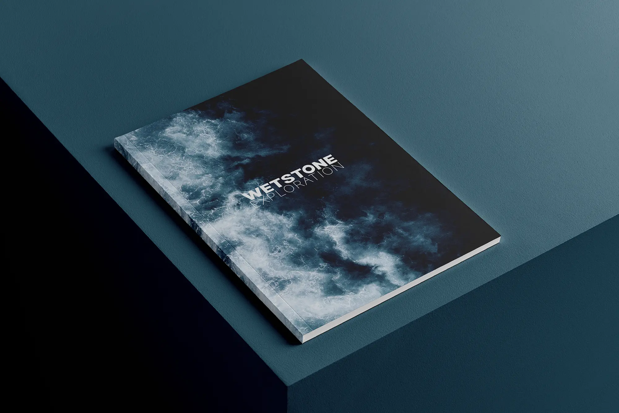 Professional editorial design and layout for a high-end publication, printed on 100lb gloss cover stock at our Manhattan shop and shown on a deep teal background.