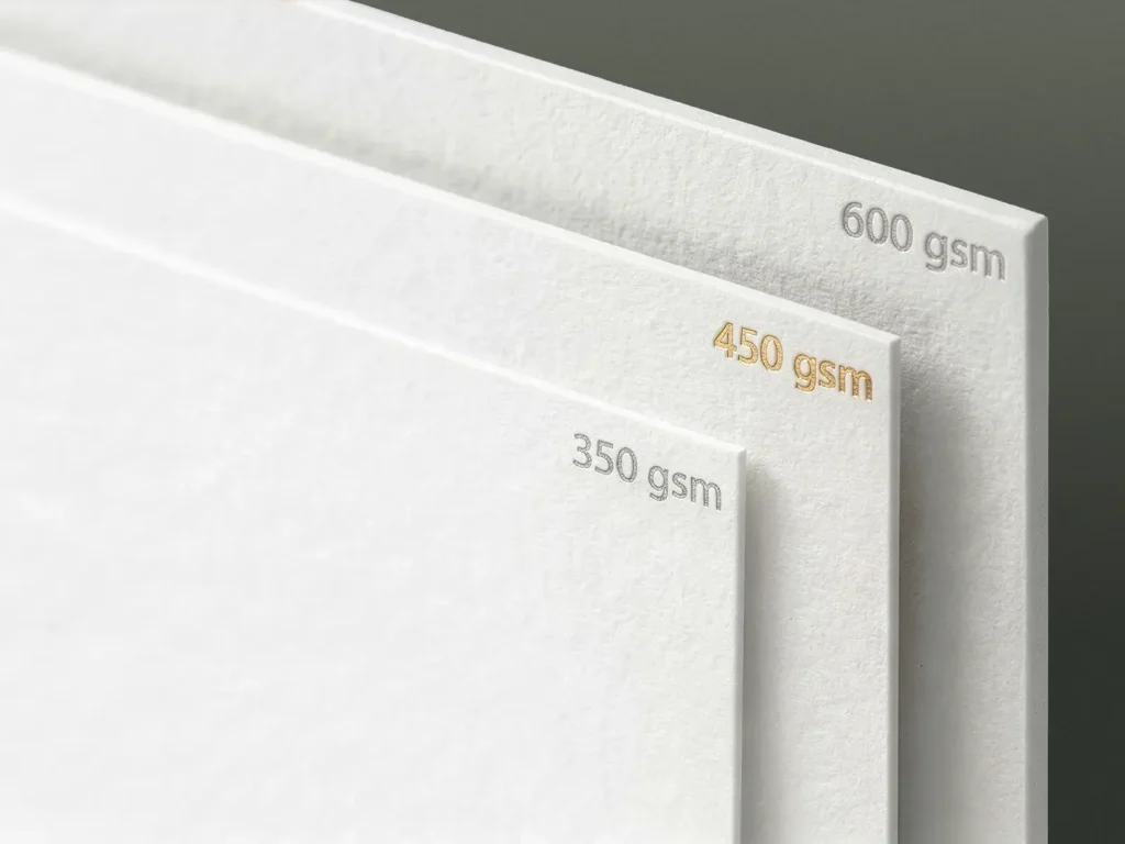 Comparison of standard, premium, and extra-thick business card paper weights—with emphasis on 450 GSM stock—showcasing the range of durable cardstock we offer for our NYC clients.