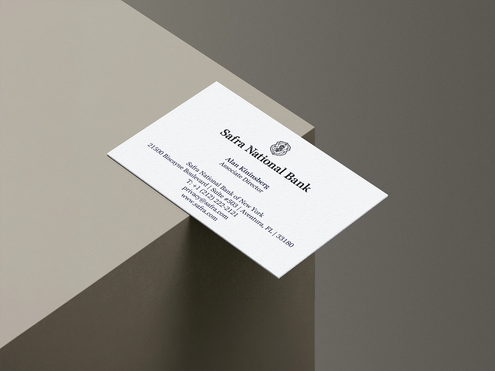 Executive business cards for Safra National Bank, featuring crisp navy typography on ultra-white 165 lb paper with a professional smooth finish.