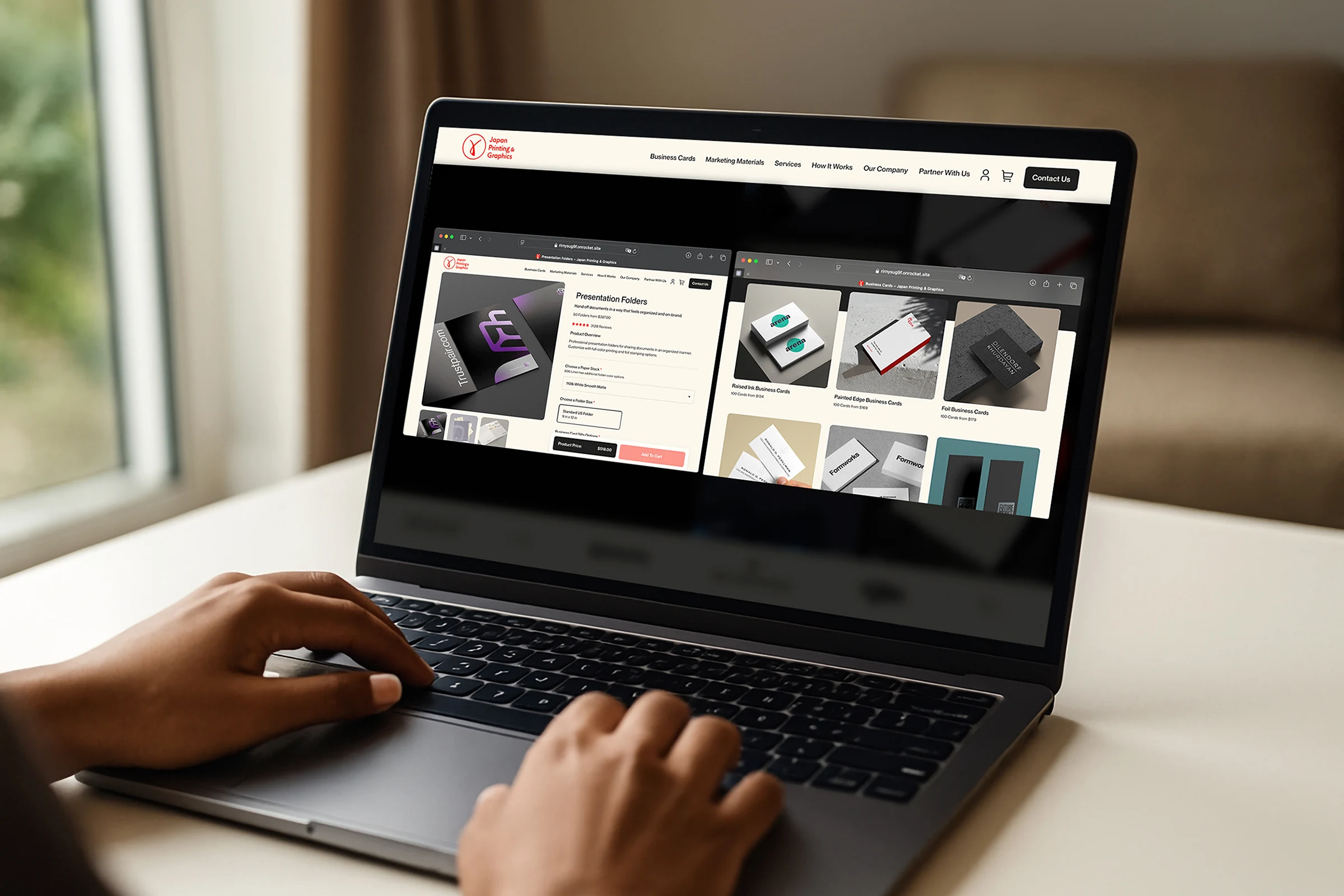 A user browsing our Japan Printing and Graphics website on a laptop shopping custom presentation folders and premium business cards to be printed at our NYC print shop.