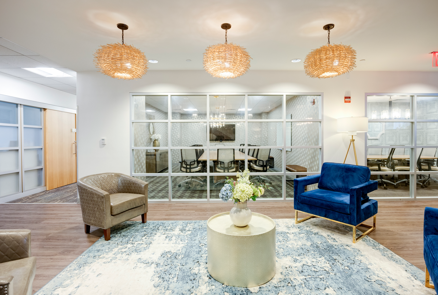 Modern lounge and glass-walled conference rooms at the Japan Printing and Graphics sales office in downtown New York City, where corporate and enterprise clients meet to order business cards, stationery and custom printing.